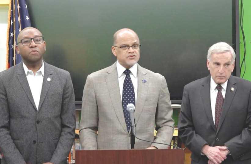  New York City Schools Chancellor David Banks, center, speaks on Monday at Hillcrest High School, where students rioted against a Jewish teacher who showed support for Israel. (photo credit: JTA)
