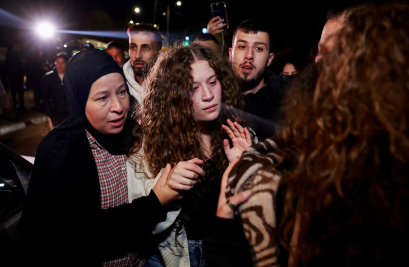  Palestinian activist Ahed Tamimi reacts as she is welcomed after being released amid a hostages-prisoners swap deal between Hamas and Israel, in Ramallah, in the West Bank, November 30, 2023.  (photo credit: REUTERS/AMMAR AWAD)