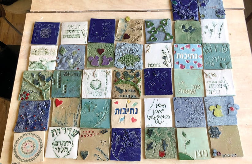  OVER 40 evacuees created a ceramic tile mosaic showing where they come from. (photo credit: CECILIA LIND)