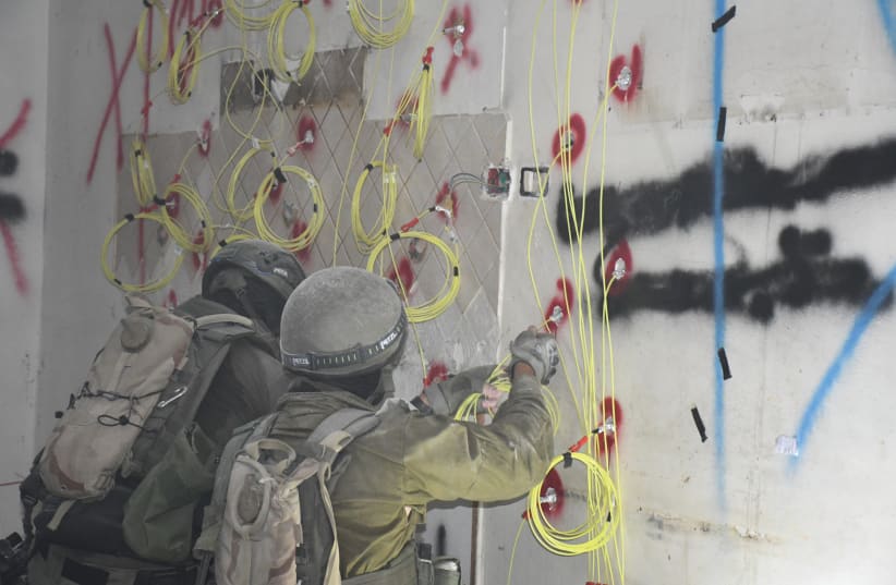  IDF SOLDIERS prepare the home of a terrorist for demolition in the early hours of November 28.  (photo credit: SETH J. FRANTZMAN)