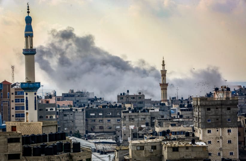  Smoke rises after Israeli airstrikes as it seen from Rafah, in the southern Gaza Strip, December 1, 2023 (photo credit: ABED RAHIM KHATIB/FLASH90)
