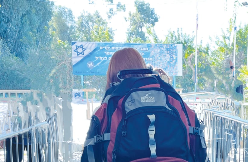  THE WRITER'S daughter walks to her bus on her 'yom giyus,' draft day. (photo credit: ANDREA SAMUELS)