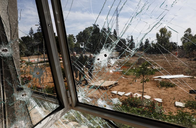  A view shows a bullet-riddled window, following a deadly infiltration by Hamas gunmen from the Gaza Strip, in Kibbutz Kissufim in southern Israel October 21, 2023. (photo credit: REUTERS/AMIR COHEN)