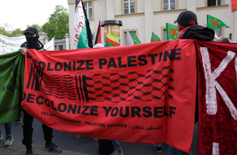  Protesters holding a pro-Palestinian banner. Mayday Revolutionary March, Berlin, 2021. (photo credit: Montecruz Foto)