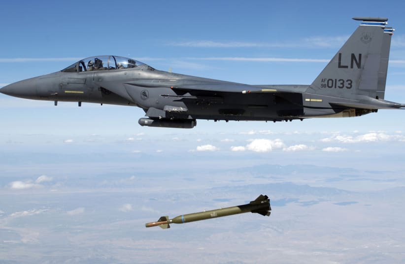 A U.S. Air Force F-15E Strike Eagle aircraft from the 492nd Fighter Squadron, Royal Air Force (RAF) Lakenheath, United Kingdom (UK) releases a GBU-28 "Bunker Buster" 5,000-pound Laser-Guided Bomb over the Utah Test and Training Range during a weapons evaluation. (photo credit: REUTERS/Technical Sgt. Michael Ammons/USAF/Handout (UNITED STATES MILITARY))
