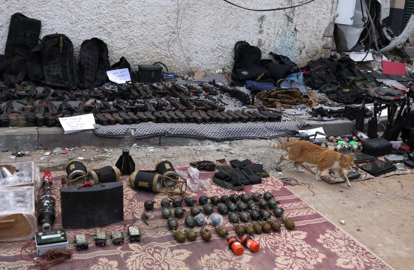  Weapons that, according to Israel's miliitary, were found at Al Shifa Hospital compound in Gaza City, amid the ongoing ground operation of the Israeli army against Palestinian terrorist group Hamas, in the Gaza Strip, November 22, 2023.  (photo credit: REUTERS/Ronen Zvulun)