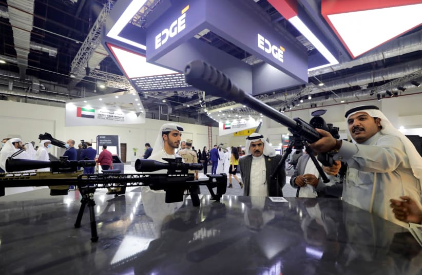  Visitors check a weapon at the UAE stand at Egypt Defence Expo (EDEX), showcasing military systems and hardware, in Cairo, Egypt, November 30, 2021. (photo credit: REUTERS/MOHAMED ABD EL GHANY)