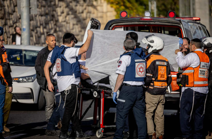  Israeli security at the scene of a terror shooting attack at the entrance to Jerusalem where Hamas-affiliated terrorists killed three Israelis and an IDF soldier killed one more, Yuval Castleman, Nov. 30, 2023. (photo credit: CHAIM GOLDBEG/FLASH90)