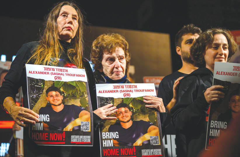  YELENA TROUFANOV (center), who was released by Hamas last week, speaks during a rally in Tel Aviv calling for the remaining hostages to be released. (photo credit: Alexi J. Rosenfeld/Getty Images)