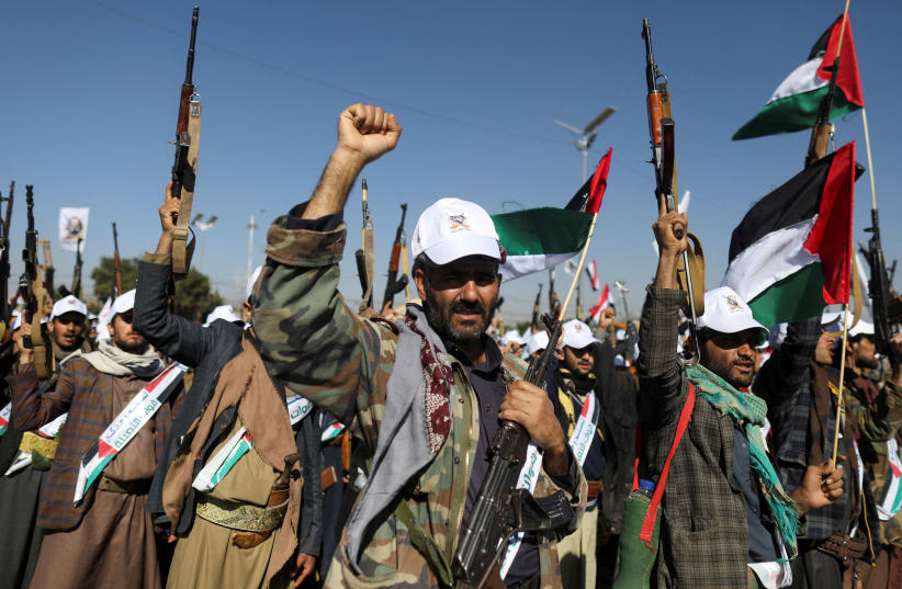  Newly recruited fighters who joined a Houthi military force intended to be sent to fight in support of the Palestinians in the Gaza Strip, march during a parade in Sanaa, Yemen December 2, 2023.  (photo credit: REUTERS/KHALED ABDULLAH)