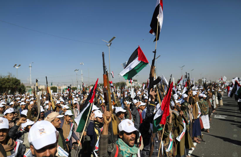  Newly recruited fighters who joined a Houthi military force intended to be sent to fight in support of the Palestinians in the Gaza Strip, march during a parade in Sanaa, Yemen December 2, 2023. (photo credit: REUTERS/KHALED ABDULLAH)