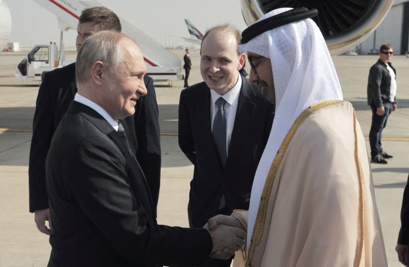  Russian President Vladimir Putin is welcomed by Minister of Foreign Affairs of the United Arab Emirates Sheikh Abdullah bin Zayed bin Sultan Al Nahyan upon arrival at the Abu Dhabi International Airport, United Arab Emirates December 6, 2023 (photo credit: Sputnik/Andrey Gordeev/Pool via REUTERS)