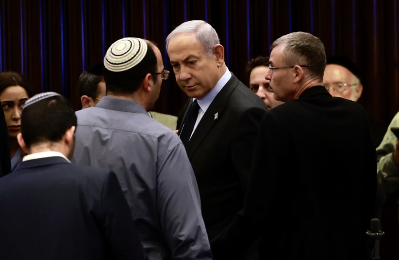 Prime Minister Benjamin Netanyahu seen in the Knesset plenum on December 6, 2023 (photo credit: MARC ISRAEL SELLEM)