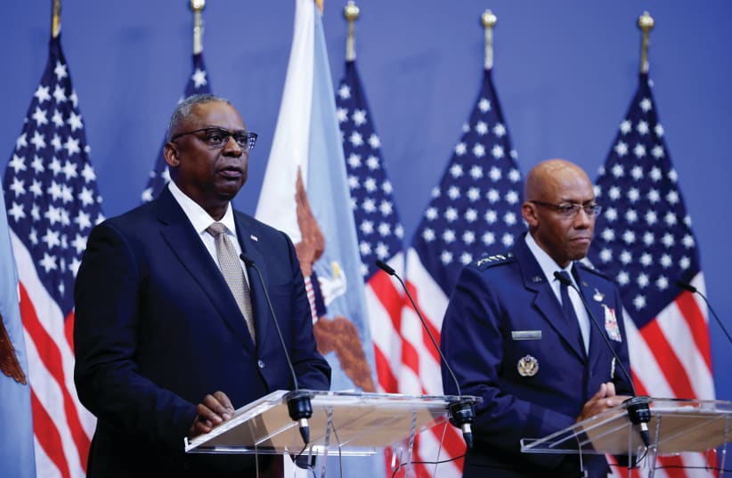  US Defense Secretary Lloyd Austin and Chairman of the Joint Chiefs of Staff Gen. Charles Q. Brown hold a news conference during a meeting of NATO defense ministers in Brussels, in October. (photo credit: JOHANNA GERON/REUTERS)