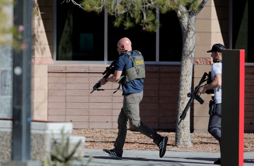  Law enforcement officers head into UNLV campus after reports of an active shooter in Las Vegas (photo credit: REUTERS)