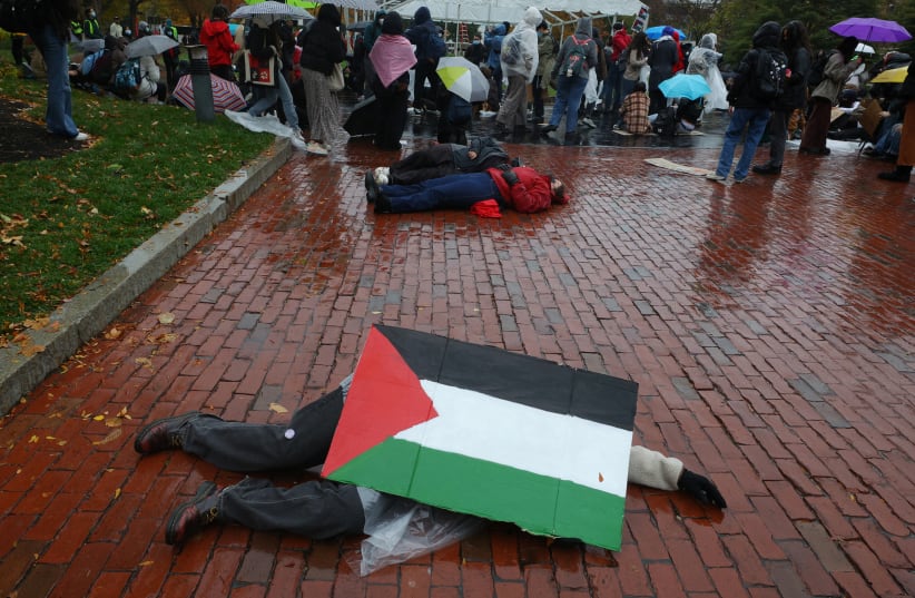  Students at Northeastern University hold a ‘Die-In for Gaza’ in Boston, Massachusetts, on November 9.  (photo credit: BRIAN SNYDER/REUTERS)