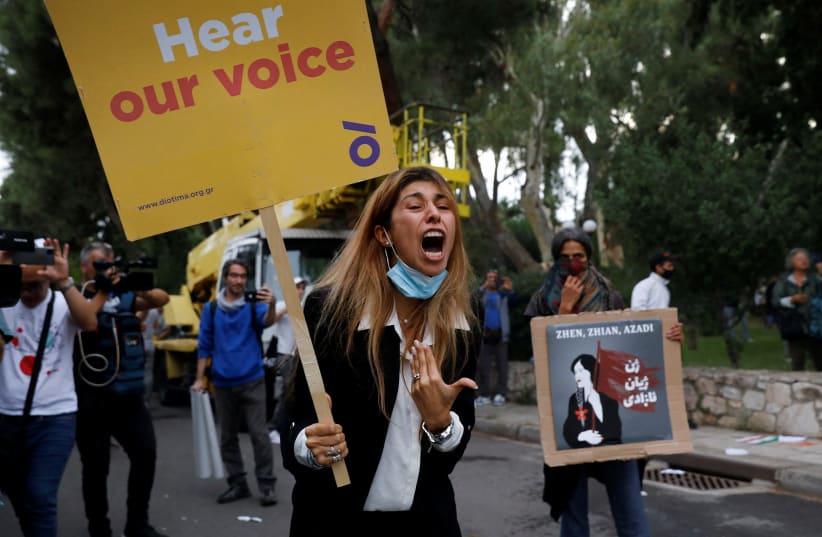  A woman reacts during a protest following the death of Mahsa Amini, outside the Iranian Embassy in Athens, Greece, September 27, 2022. (photo credit: REUTERS/COSTAS BALTAS)
