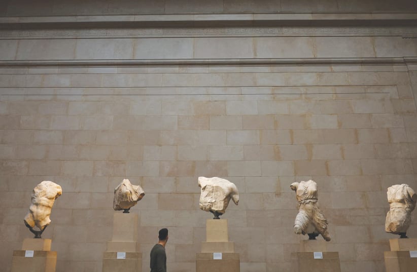  RELEGATED TO a display: At the British Museum, sculptures from the Parthenon, the temple on Athens’ Acropolis that stood as a Greek monument to democracy. (photo credit: HANNAH MCKAY/ REUTERS)