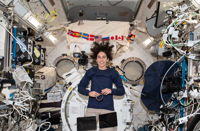  NASA astronaut and Expedition 70 Flight Engineer Jasmin Moghbeli takes a break during operations and poses for a portrait inside the International Space Station's Kibo laboratory module. (photo credit: NASA/JSC)