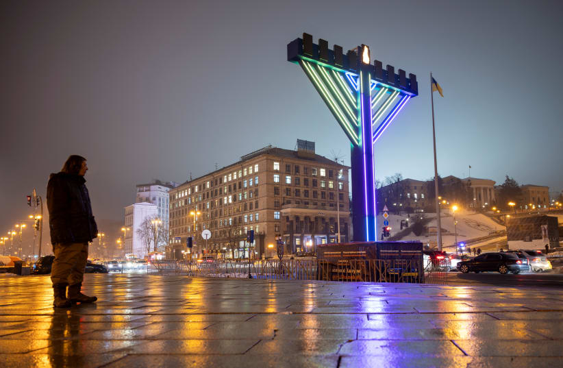  A menorah is illuminated to mark the Jewish festival of Hanukkah at Independence Square, amid Russia's attack on Ukraine, in Kyiv, Ukraine December 7, 2023. (photo credit: REUTERS/THOMAS PETER)
