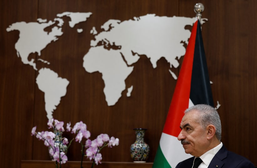  Palestinian Prime Minister Mohammad Shtayyeh speaks to Reuters at his office in Ramallah, in the West Bank, November 15, 2023 (photo credit: REUTERS/JAMES OATWAY)