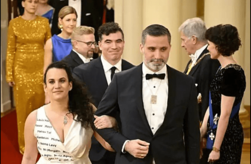 The President of the Jewish Community of Finland Yaron Nadbornik wore a #bringthemhomenow necklace, while his wife, Galith’s, dress featured the names of the hostages. (photo credit: EUROPEAN JEWISH CONGRESS)
