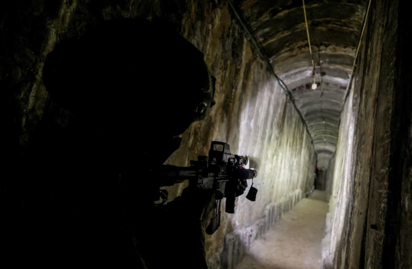  An Israeli soldier secures a tunnel underneath Al Shifa Hospital in Gaza City, amid the ongoing ground operation of the Israeli army against Hamas, in the northern Gaza Strip, November 22, 2023. (photo credit: REUTERS/Ronen Zvulun)