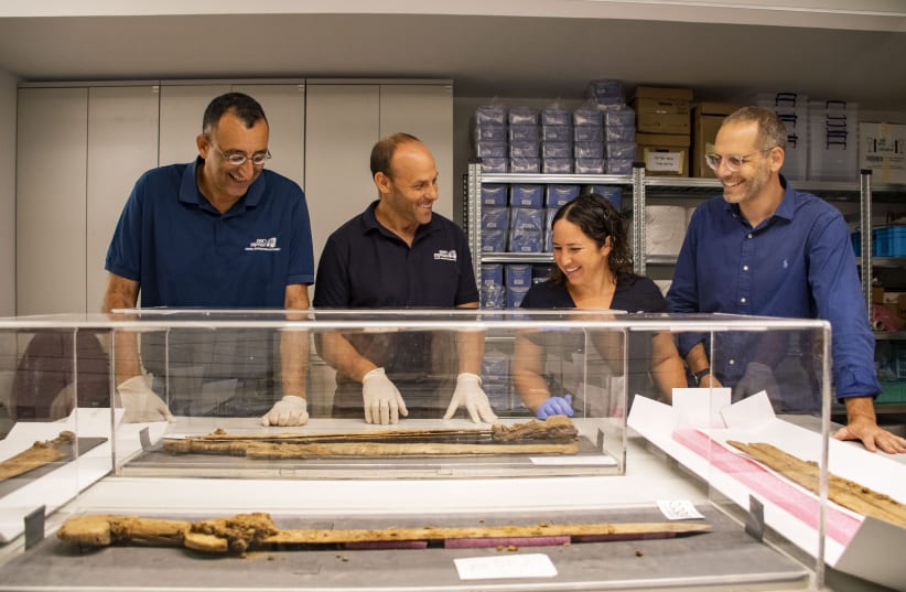  From right to left: Dr. Asaf Gayer, Oriya Amichay Dr. Eitan Klein and Amir Ganor with their findings (photo credit: YOLI SCHWARTZ/ISRAEL ANTIQUITIES AUTHORITY)