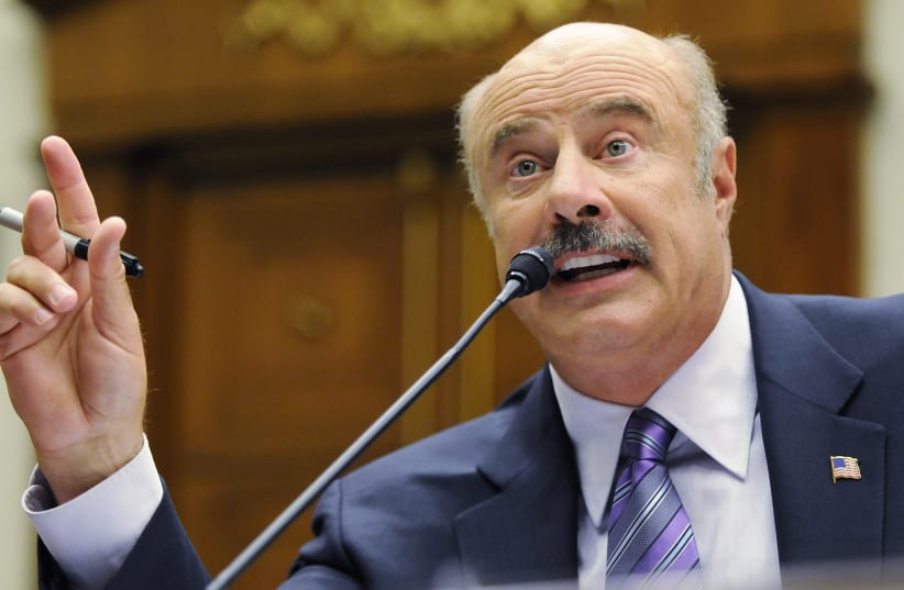 Dr. Phil McGraw, television personality and psychologist, talks about cyber-bullying during a hearing of the Healthy Families and Communities Subcommittee of the U.S. House Committee on Education and Labor, on Capitol Hill in Washington, June 24, 2010. (photo credit: REUTERS/JONATHAN ERNST)
