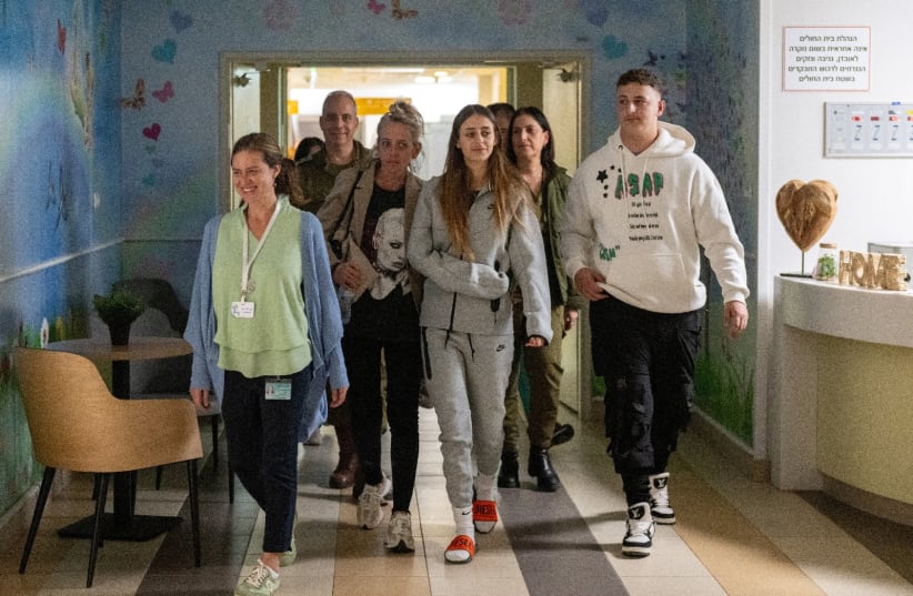  Mia?Schem, 21, reunites with her family following her release after being held hostage by Hamas in the Gaza Strip, at Sheba Medical Center in Ramat Gan, Israel (photo credit: THE MEDIA OFFICE OF THE PRIME MINISTER/HANDOUT VIA REUTERS)