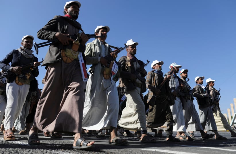 Newly recruited fighters who joined a Houthi military force intended to be sent to fight in support of the Palestinians in the Gaza Strip, march during a parade in Sanaa, Yemen December 2, 2023 (photo credit: REUTERS/KHALED ABDULLAH)