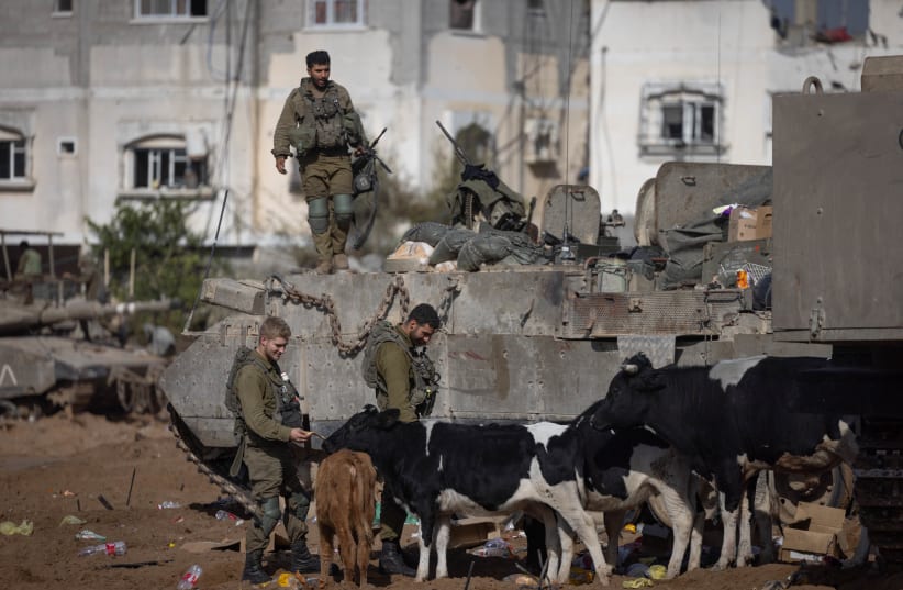  Israeli soldiers at the Jabalya refugee camp, in the northern Gaza Strip, during an Israeli military operation in the Gaza Strip, December 12, 2023 (photo credit: Chaim Goldberg/Flash90)