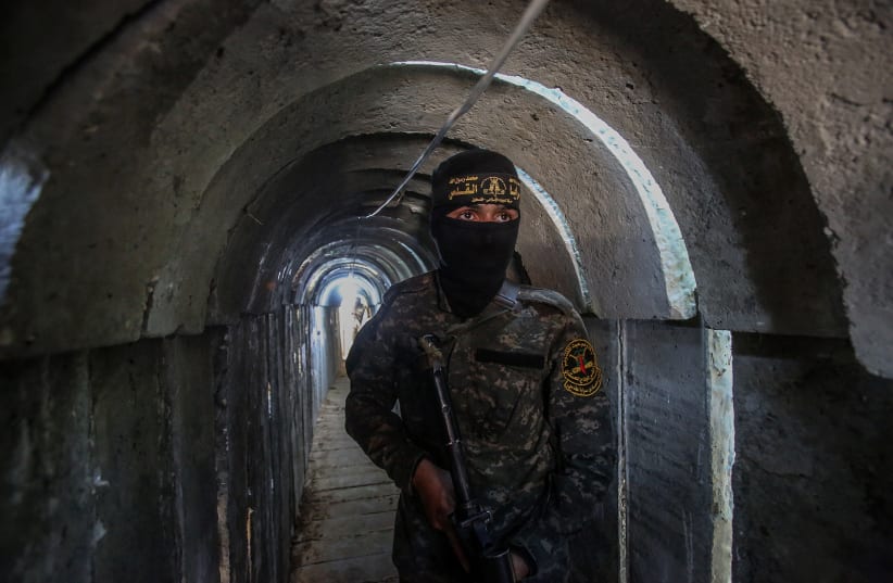  A Palestinian fighter of the Al-Quds brigades, the military wing of Palestinian Islamic Jihad (PIJ), seen inside a military tunnel in Beit Hanun, in the Gaza Strip, on May 18, 2022.  (photo credit: ATTIA MUHAMMED/FLASH90)