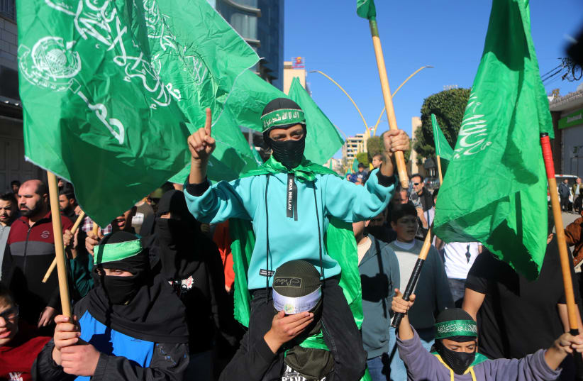  Hamas supporters take part in a protest in support of the people of Gaza in Hebron, West Bank, December 15, 2023 (photo credit: FLASH90/WISAM HASLMAOUN)