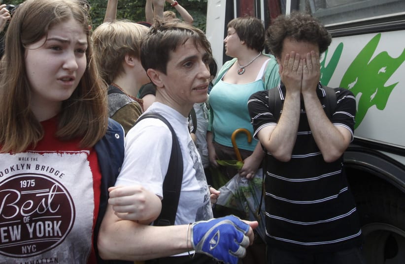 Russia-born U.S. journalist Masha Gessen (front C) takes part in a protest against a proposed new law termed by the State Duma as "against advocating the rejection of traditional family values" in central Moscow June 11, 2013. (photo credit: REUTERS/MAXIM SHEMETOV)