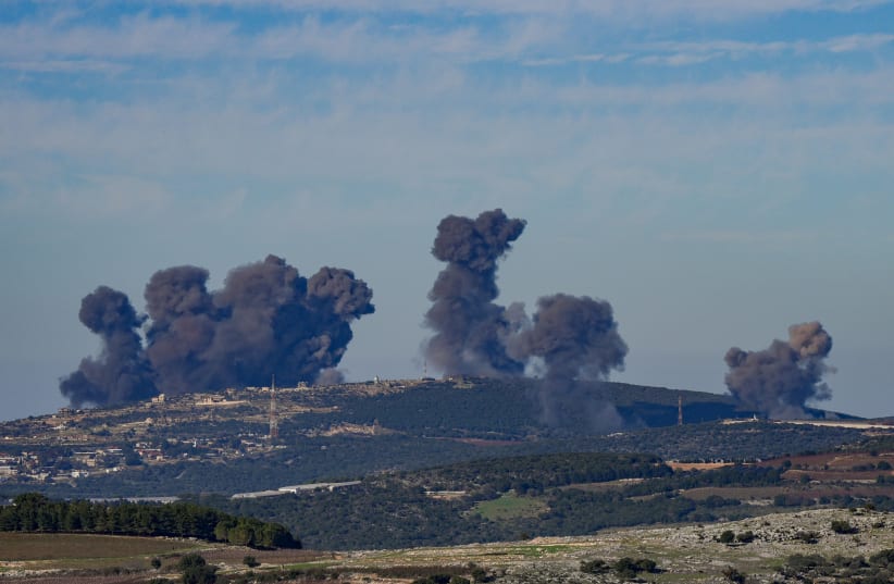 Smoke rises during an exchange of fire between the IDF and terrorists from the Hezbollah organization on December 16, 2023 (photo credit: AYAL MARGOLIN/FLASH90)