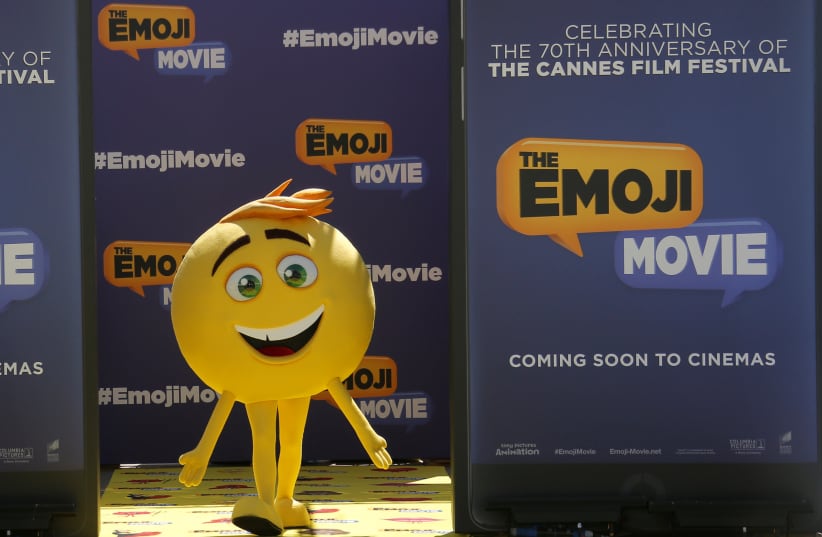  An Emoji character is seen during a photocall for the film "The Emoji Movie". (photo credit: REUTERS/STEPHANE MAHE)