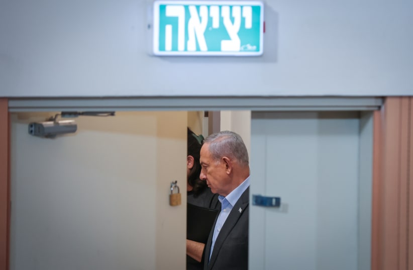  Prime Minister Benjamin Netanyahu arrives to a press conference in Tel Aviv. December 16, 2023 (photo credit: NOAM REVKIN FENTON/FLASH90)