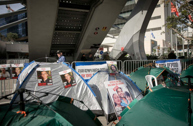  View of protest tents set up by families of Israelis held kidnapped by Hamas terrorists in Gaza, outside Hakirya Base in Tel Aviv, December 17, 2023.  (photo credit: MIRIAM ALSTER/FLASH90)