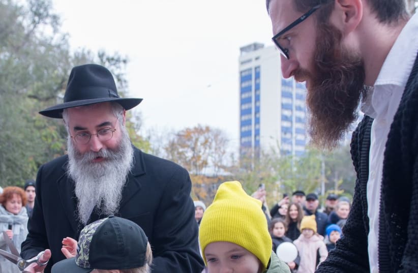  Ribbon cutting at the opening of the new children's home facility.   (photo credit: CHABAD)