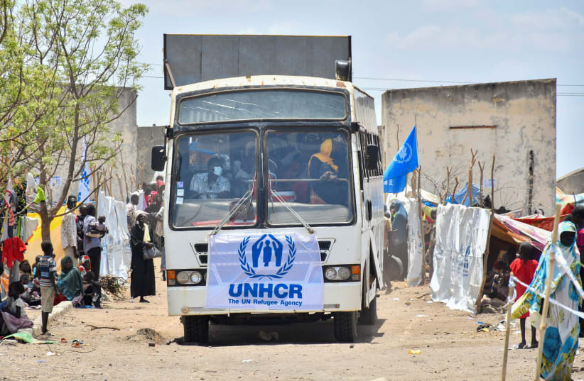  Civilians who fled the war-torn Sudan arrive in a courtesy bus near the border crossing point in Renk County of Upper Nile State, South Sudan May 1, 2023 (photo credit: REUTERS/JOK SOLOMUN)