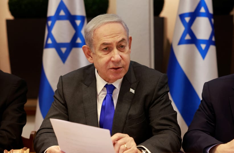  Israeli Prime Minister Benjamin Netanyahu chairs a cabinet meeting at the Kirya, December 17, 2023 (photo credit: MENAHEM KAHANA/POOL VIA REUTERS)