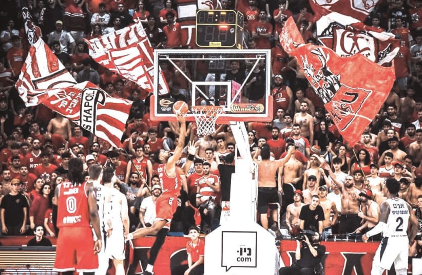  HAPOEL TEL AVIV fans made their presence known loud and clear in their return to the Drive-In Arena for the Reds’ 112-76 league victory over Hapoel Eilat (photo credit: YEHUDA HALICKMAN)