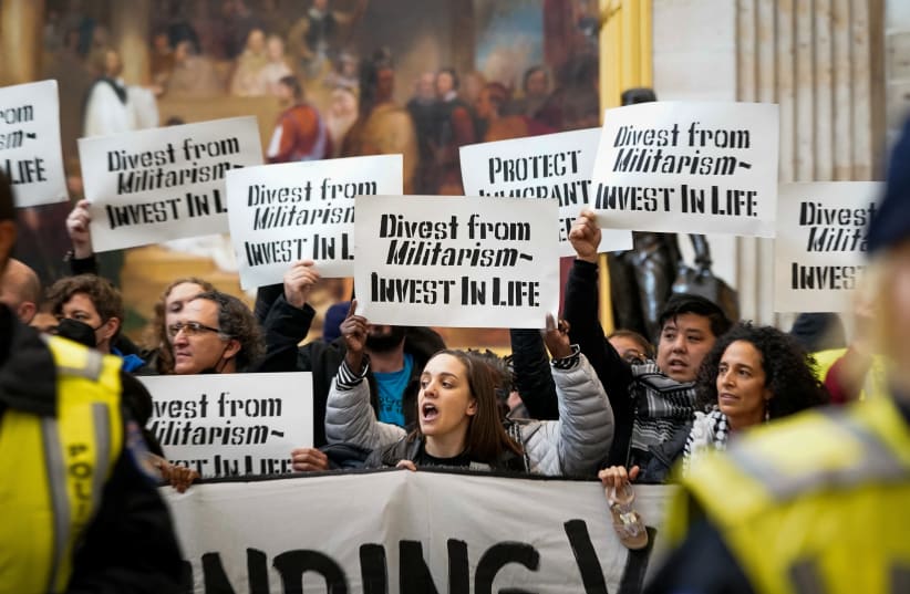  Protesters call for a ceasefire and an end to US military funding in the ongoing conflict between Israel and the Palestinian Islamist group Hamas, as they demonstrate inside the Rotunda of the US Capitol in Washington DC, December 19, 2023. (photo credit: REUTERS/ELIZABETH FRANTZ)