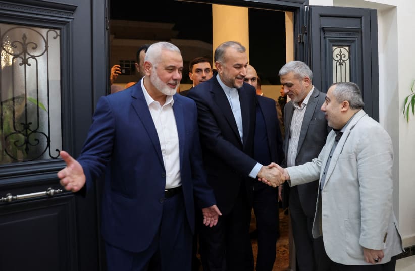  Iran's Foreign Minister Hossein Amir Abdollahian meets with Palestinian group Hamas' top leader, Ismail Haniyeh in Doha, Qatar December 20, 2023.  (photo credit: IRAN'S FOREIGN MINISTRY/WANA (WEST ASIA NEWS AGENCY)/HANDOUT VIA REUTERS)