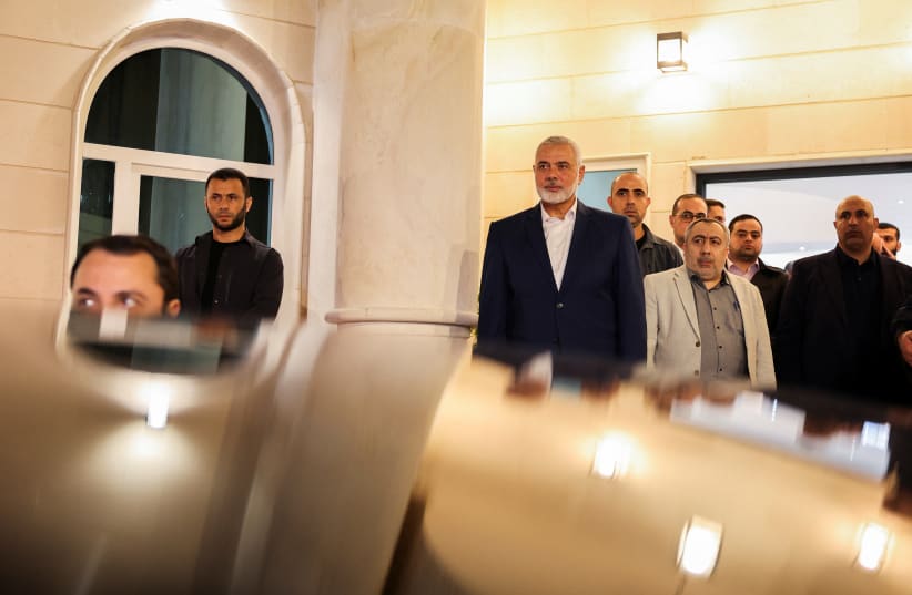   Hamas' top leader, Ismail Haniyeh looks on as he waits to meet with Iran's Foreign Minister Hossein Amir Abdollahian in Doha, Qatar December 20, 2023. (photo credit:  Iran's Foreign Ministry/WANA (West Asia News Agency)/Handout via REUTERS)