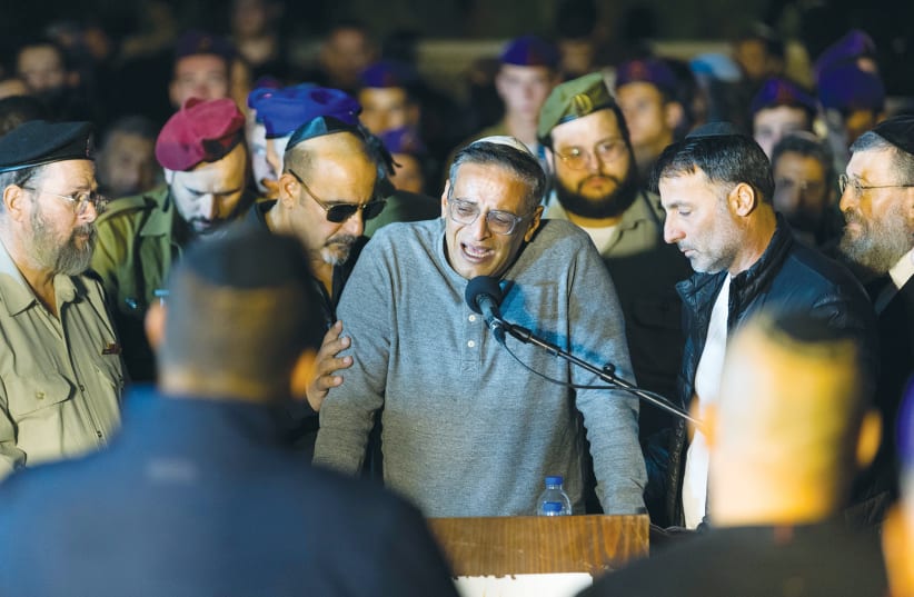  MOURNERS ATTEND the funeral, in Rehovot, of IDF Captain Yarin Gahali, killed in the Gaza Strip this week. Our generation has the task of extolling the heroism of those murdered in defense of our country, says the writer.  (photo credit: Liron Moldovan/Flash90)