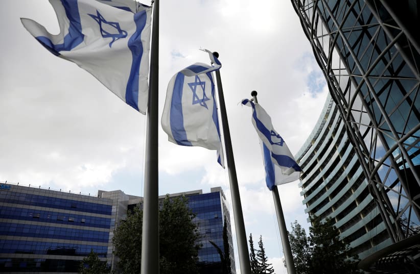  Israeli flags flutter at Ofer Park in Petah Tikva, which houses hi-tech companies. (photo credit: RONEN ZVULUN/REUTERS)