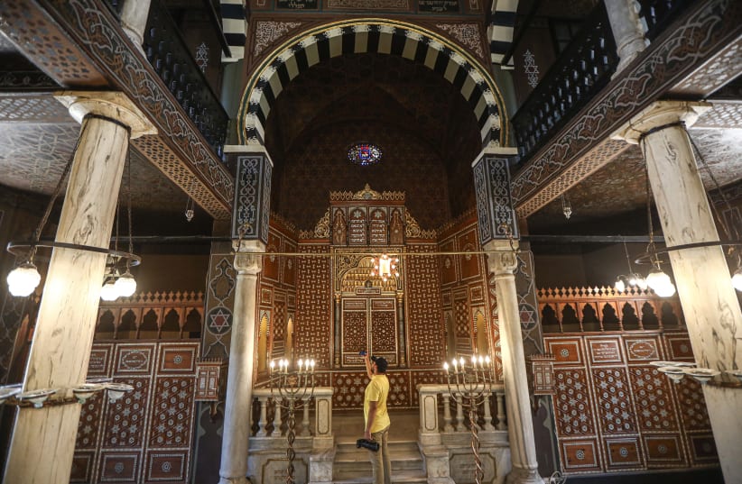  A man takes photos inside the Jewish Ben Ezra Synagogue after its restoration in Cairo, Sept. 1, 2023. (photo credit: Ahmed Gomaa/Xinhua via Getty Images)