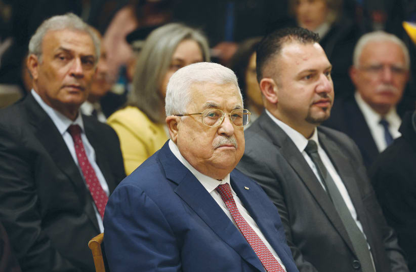  PALESTINIAN AUTHORITY head Mahmoud Abbas attends Christmas Midnight Mass at the Church of the Nativity in Bethlehem, last year. Abbas, in recent years, has depicted Jesus as Palestinian, says the writer. (photo credit: Ahmad Gharabli/Reuters)